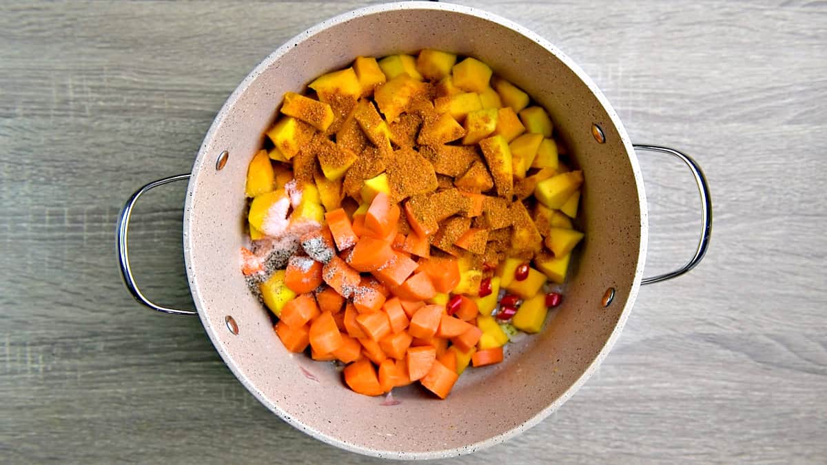 Pumpkin, carrot, chili, and seasonings in a large stock pot. 