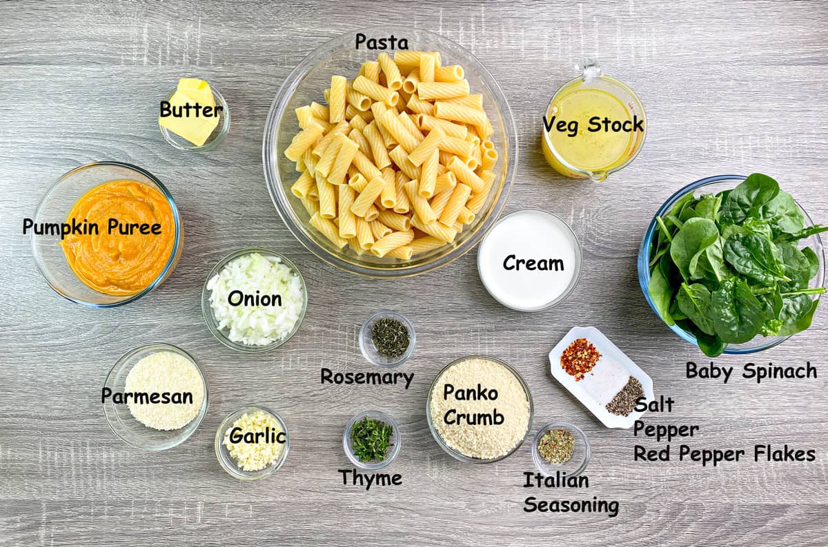 Bowls of pasta, butter, vegetable stock, cream, spinach, salt, pepper, red pepper flakes, panko breadcrumbs, Italian seasoning, thyme, rosemary, onion, garlic, parmesan, and pumpkin puree. 