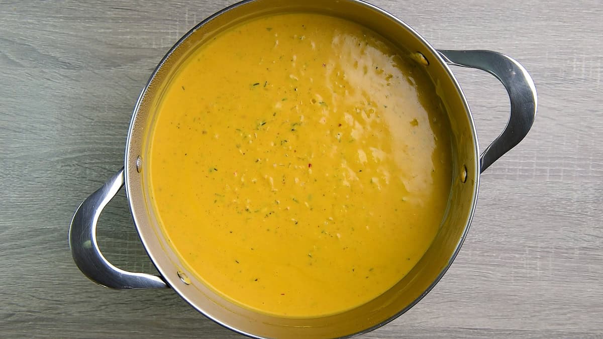 A pot full of pumpkin pasta sauce.