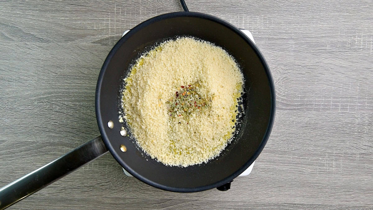 Added breadcrumbs and Italian seasoning in a skillet.