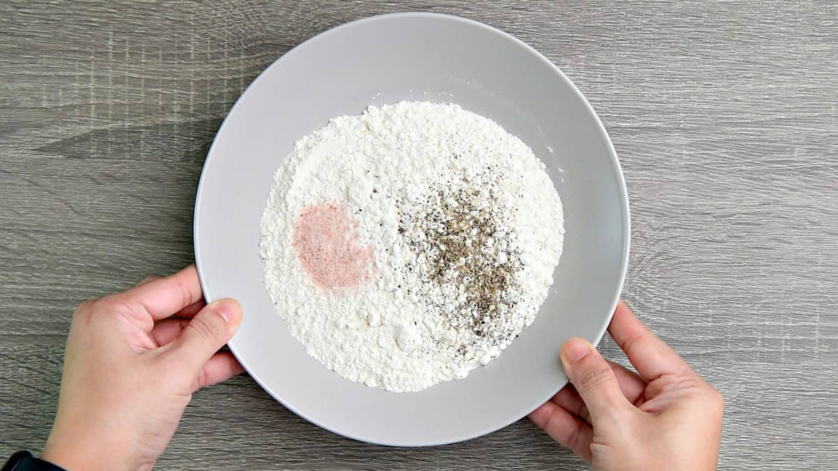 Combine flour with salt and freshly ground pepper in a separate bowl.